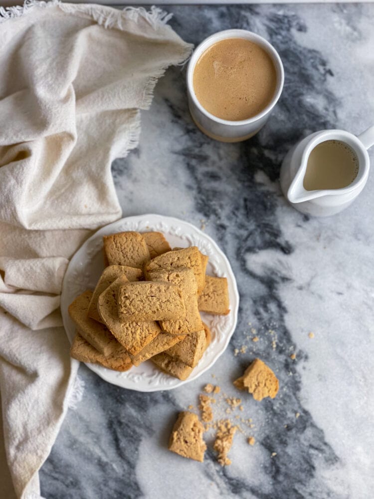 gluten-free chestnut cookies on a marble board with a coffee cup