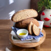 Gluten-free artisan bread loaf with oil bowl