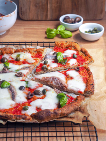 Gluten free pizza with mozzarella and anchovies