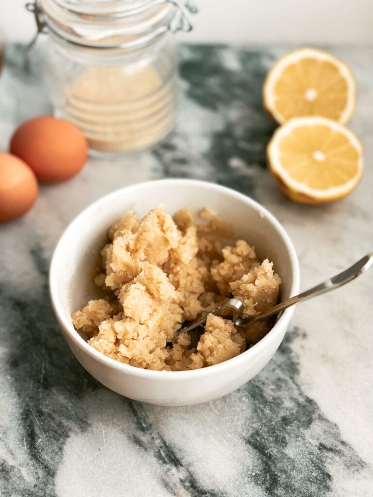 Bowl with almond flour sugar and egg white